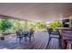 Outdoor deck features comfortable seating and picturesque views of the surrounding greenery and landscaping at 1061 Lowry Ave, Lakeland, FL 33801