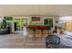 Relaxing back deck area equipped with a bar, mini fridge, and seating, perfect for entertaining outdoors at 1061 Lowry Ave, Lakeland, FL 33801