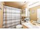 Bathroom with a patterned shower curtain and vanity at 1061 Lowry Ave, Lakeland, FL 33801