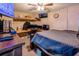 Bedroom with desk, ceiling fan, and mounted TV at 1061 Lowry Ave, Lakeland, FL 33801