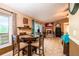 Cozy dining area with natural light, tile floors, and a dining table perfect for Gathering meals and entertaining at 1061 Lowry Ave, Lakeland, FL 33801