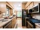 Functional kitchen with stainless steel appliances, tile floors, and plenty of storage, perfect for cooking at 1061 Lowry Ave, Lakeland, FL 33801