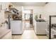 Well-organized laundry room features modern appliances and ample storage shelves for convenience at 1061 Lowry Ave, Lakeland, FL 33801