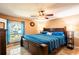 Inviting main bedroom with a large window and ceiling fan at 1061 Lowry Ave, Lakeland, FL 33801