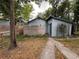 Secluded backyard featuring a privacy fence, a walkway, and lush greenery, enhancing outdoor enjoyment at 1217 King Ave, Lakeland, FL 33803