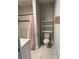 Well-lit bathroom featuring a shower, vanity, marble tile, and modern toilet at 1217 King Ave, Lakeland, FL 33803