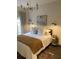 Comfortable bedroom featuring a cozy bed, natural light, and chic decor, creating a serene and inviting atmosphere at 1217 King Ave, Lakeland, FL 33803