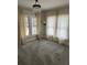 Bright bedroom featuring two large windows dressed with flowing beige curtains at 1217 King Ave, Lakeland, FL 33803
