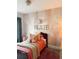 bedroom featuring custom wall decor, a cozy rug, and a comfortable bed at 1217 King Ave, Lakeland, FL 33803
