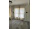 Bedroom is highlighted with large windows and sconces adorning either side of the window at 1217 King Ave, Lakeland, FL 33803