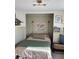 Charming bedroom with unique decor, featuring a comfortable bed and custom wall map and mounted lights at 1217 King Ave, Lakeland, FL 33803