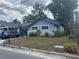 Charming home with lush front yard, showcasing its curb appeal in a serene neighborhood at 1217 King Ave, Lakeland, FL 33803