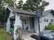 Charming home featuring a welcoming front porch and attached basketball hoop for recreational enjoyment at 1217 King Ave, Lakeland, FL 33803