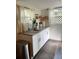 Bright and clean kitchen with granite countertops, white cabinets, stainless steel faucet, and window views at 1217 King Ave, Lakeland, FL 33803