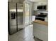 Bright kitchen with stainless steel appliances, including a refrigerator, stove, and kitchen island at 1217 King Ave, Lakeland, FL 33803