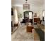 Cozy living room featuring a fireplace, archway, neutral color palette, and comfortable seating at 1217 King Ave, Lakeland, FL 33803