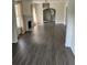 Bright living room featuring a decorative fireplace, arched doorway, and modern flooring at 1217 King Ave, Lakeland, FL 33803