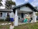 Inviting covered front porch with outdoor seating, perfect for enjoying the neighborhood views at 1217 King Ave, Lakeland, FL 33803