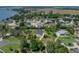 An aerial view of property located on a large lot with mature landscaping at 130 Sylvana Ct, Auburndale, FL 33823