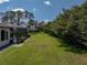 Large fenced in backyard with manicured lawn and plenty of privacy at 130 Sylvana Ct, Auburndale, FL 33823