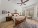 Bright bedroom with wood flooring, a bay window, and a large ceiling fan at 130 Sylvana Ct, Auburndale, FL 33823