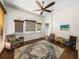 Cozy bonus room with tiled floors, and windows with views and a ceiling fan at 130 Sylvana Ct, Auburndale, FL 33823
