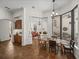 Dining area with a view of the pool, adjacent to a wet bar and a living room at 130 Sylvana Ct, Auburndale, FL 33823