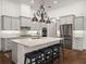 Modern kitchen with granite countertops, a large island, and stainless steel appliances at 130 Sylvana Ct, Auburndale, FL 33823