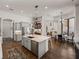Spacious kitchen offering an open-concept design with large island, granite countertops, and modern appliances at 130 Sylvana Ct, Auburndale, FL 33823