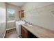 Functional laundry room with a washer, dryer, sink, and cabinet storage at 130 Sylvana Ct, Auburndale, FL 33823