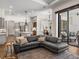 Open-concept living space showcasing a comfortable seating area and a view into the kitchen at 130 Sylvana Ct, Auburndale, FL 33823