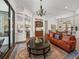 Spacious living room showcasing columns, a wet bar, and an open design at 130 Sylvana Ct, Auburndale, FL 33823
