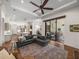 Spacious living area with a large sectional sofa and sliding glass doors to the patio at 130 Sylvana Ct, Auburndale, FL 33823