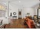 Living room leading to an entryway and showcasing tile flooring and stylish décor at 130 Sylvana Ct, Auburndale, FL 33823