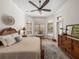 Inviting main bedroom with natural light, ceiling fan, and decorative rug at 130 Sylvana Ct, Auburndale, FL 33823