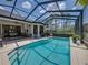 Sparkling swimming pool and patio area, enclosed with a screen, perfect for outdoor entertaining at 130 Sylvana Ct, Auburndale, FL 33823