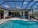 Beautiful swimming pool and patio area, enclosed with a screen, perfect for outdoor entertaining at 130 Sylvana Ct, Auburndale, FL 33823