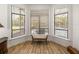 Bright sitting area with natural light coming through large windows with a view of the pool at 130 Sylvana Ct, Auburndale, FL 33823