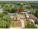 Aerial view of the property showcasing the home's layout, fenced yard, and surrounding greenery at 137 Leitha Way, Lakeland, FL 33809