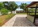 Spacious backyard featuring patio, shed, grass, landscaping and fence at 137 Leitha Way, Lakeland, FL 33809