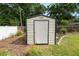 View of the shed located in the backyard of the home with grass and a privacy fence at 137 Leitha Way, Lakeland, FL 33809