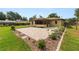 Spacious backyard featuring a patio, partial privacy fence, grass, landscaping, and a screened-in porch at 137 Leitha Way, Lakeland, FL 33809