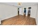 Spacious bedroom featuring neutral paint, wood flooring, and access to a bathroom at 137 Leitha Way, Lakeland, FL 33809