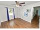 Bedroom features a ceiling fan, closet, and large window letting in natural light at 137 Leitha Way, Lakeland, FL 33809