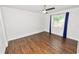 A bright and airy bedroom featuring hardwood floors, ceiling fan, and ample natural light at 137 Leitha Way, Lakeland, FL 33809