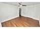 Bedroom featuring a ceiling fan, closet and neutral walls with wood flooring at 137 Leitha Way, Lakeland, FL 33809