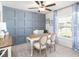 Bright home office with a decorative accent wall, ceiling fan, and plenty of natural light at 1424 Portmore Dr, Mulberry, FL 33860