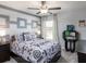 A charming bedroom with a ceiling fan, carpeted floors, and a bright window at 1429 Fleur Dr, Davenport, FL 33837