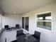 A covered patio features neutral paint, patio furniture, and views of the backyard at 1429 Fleur Dr, Davenport, FL 33837