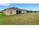 Spacious backyard featuring a screened patio and a white picket fence at 1470 Silver Leaf Dr, Lakeland, FL 33813